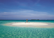SINGLE WOMAN ON A SANDBANK, NORTH MALE ATOLL, MALDIVES