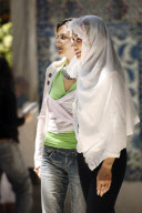 Two women walk in a mosque of the Eyup district, Istanbul