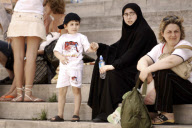 Occidental and traditional look women in a street of Istanbul