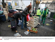 PARIS: Scavengers go through dustbins for food