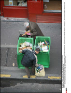 PARIS: Scavengers go through dustbins for food