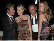 Designer CHRISTIAN AUDIGIER and pregnant girlfriend IRA arriving at 'Treasure Island' hotel