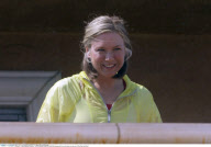 Actress RENEE ZELLWEGER playing with her cell phone on the set of 'My One And Only'