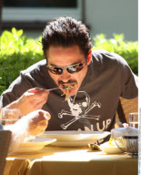 Actor ROBERT DOWNEY JR munching a bowl spaghetti