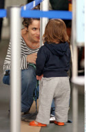 EXCL.: Actress AMANDA PEET and her family arriving at Vancouver airport