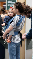 EXCL.: Actress AMANDA PEET and her family arriving at Vancouver airport