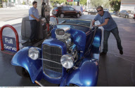 Musician JOHNNY HALLYDAY driving his 1932 Ford vintage roadster