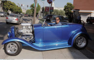 Musician JOHNNY HALLYDAY driving his 1932 Ford vintage roadster