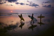 LIFESAVERS LEAVING THEIR POST, KUTA BEACH, BALI, INDONESIA
