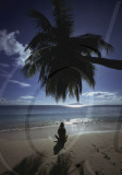 WOMAN AT BEAU VALLON BEACH,  MAHé ISLAND, SEYCHELLES