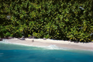 COUPLE ON BEACH ANSE VICTORIN, FRéGATE ISLAND, SEYCHELLES