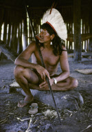 RAONI, INDIAN CHIEF WITH TRADITIONAL LIP EXTENSION AND FEATHER HAT, PREPARED FOR A MEETING, XINGU INDIAN RESERVATION, BRAZIL