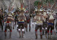 MEN WITH FEATHER HAIRDRESS HAVING A DANCE REHEARSAL AT JAVARI FESTIVAL, XINGU INDIAN RESERVATION, BRAZIL