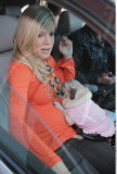 Soon-to-be mom TORI SPELLING shopping with her cute pug in a dog-stroller