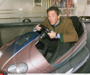 AUSTRIA:JOERG HAIDER IN A BUMPER CAR IN KLAGENFURT.