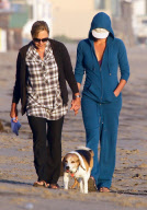Charlize Theron and Mother Play With Dogs on the Beach