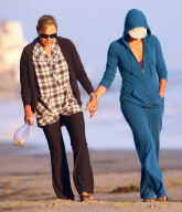 Charlize Theron and Mother Play With Dogs on the Beach