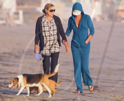 Charlize Theron and Mother Play With Dogs on the Beach