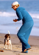 Charlize Theron and Mother Play With Dogs on the Beach