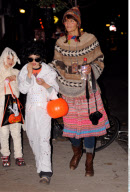 Topmodel HELENA CHRISTENSEN trick-or-treating with son MINGUS
