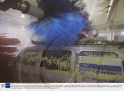 Dean Gunnarson attempts to escape after being chained to the roof of a vehicle as it goes through a car wash, Winnipeg, Manitoba, Canada - 31 Oct 2008