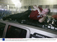 Dean Gunnarson attempts to escape after being chained to the roof of a vehicle as it goes through a car wash, Winnipeg, Manitoba, Canada - 31 Oct 2008