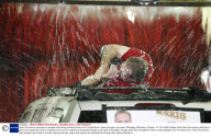 Dean Gunnarson attempts to escape after being chained to the roof of a vehicle as it goes through a car wash, Winnipeg, Manitoba, Canada - 31 Oct 2008