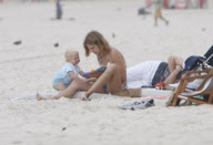 Supermodel Natalia Vodianova with his husband and son at Ipanema Beach