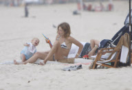Supermodel Natalia Vodianova with his husband and son at Ipanema Beach