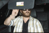 Joaquin Phoenix Wearing Pantyhose as a Glove