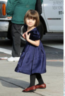 Actress KATIE HOLMES trend sets in red plaid with cupcake eating SURI