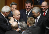 Newly elected Swiss Minister Maurer is congratulated by Party's members during the winter parliament session in Bern