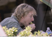 Actor OWEN WILSON tries to munch a Burrito