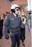 Vest-wearing actress HILARY DUFF gets a bit of police help