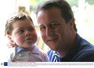 David Cameron with his son Ivan at their country home, Britain  - 16 May 2004