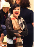 Rocker kid KELLY OSBOURNE must really have something to laugh about!