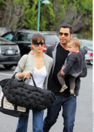 Actress JESSICA ALBA having a fit of laughter with hubby CASH WARREN and baby HONOR while leaving 'Bristol Farms' after grocery shopping