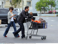 Actress JESSICA ALBA having a fit of laughter with hubby CASH WARREN and baby HONOR while leaving 'Bristol Farms' after grocery shopping