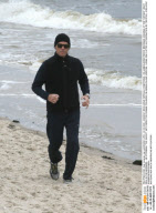 PIERCE BROSNAN JOGGING AT BEACH IN GERMANY