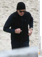 PIERCE BROSNAN JOGGING AT BEACH IN GERMANY