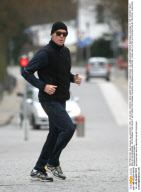PIERCE BROSNAN JOGGING AT BEACH IN GERMANY