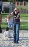 Actress SHARON STONE teaches son LAIRD to ride a scooter at the park