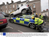 Nissan Terrano Ends Up on Top of Police Car During a Chase in Swansea, Wales, Britain - 14 Apr 2009