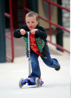 Celeb kid CRUZ BECKHAM shows his scooter who's boss