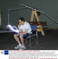 The Thinker posed by Peter Terren with electricity from a Tesla coil, Bunbury, Western Australia - Apr 2009