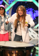 Actress MILEY CYRUS making funny faces and feeding a donky at the tv show 'The Ants' in Madrid