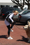 Nicolette Sheridan with her new boyfriend Steve Pate walking the dog in Malibu. She lost her shoe and was aided by a paparazzi

