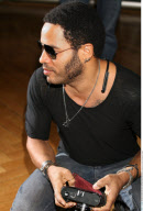 LENNY KRAVITZ taking pictures with his old fashioned Leica camera at the photocall in Madrid