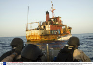 A VBSS team from the guided-missile cruiser USS Gettysburg and U.S. Coast Guard Tactical Law Enforcement Team approach a suspected pirate mothership, Gulf of Aden - 13 May 2009