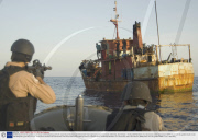 A VBSS team from the guided-missile cruiser USS Gettysburg and U.S. Coast Guard Tactical Law Enforcement Team approach a suspected pirate mothership, Gulf of Aden - 13 May 2009